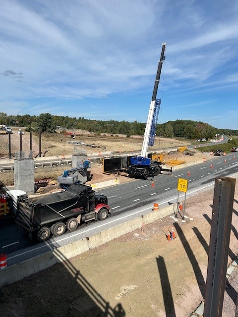 Crews construct the pier column for the new U.S. 2 bridge over I-89 within the interstate median.